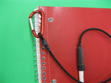 clipboard pen leash attached to notebook